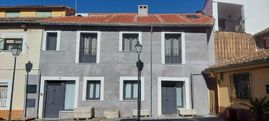Estudio de Arquitectura Félix Cuadrado fachada gris frontal de casa
